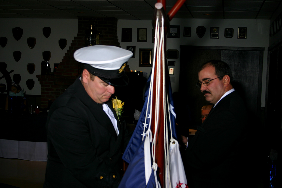 Raising Commodore\'s flag